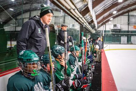 Cooper Hemphill coaching hockey.