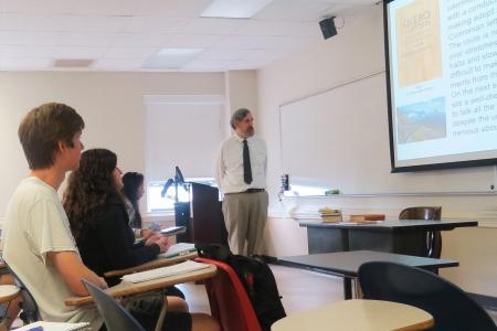 Summer Institute Director Dr. John Nicholson in classroom with students LATN 6050 